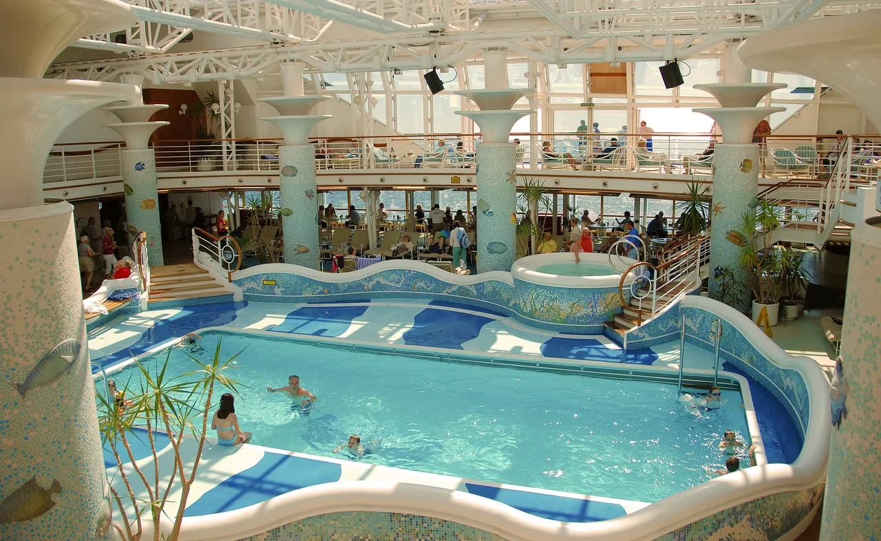 Passengers enjoying the Calypso Reef pool aboard Grand Princess